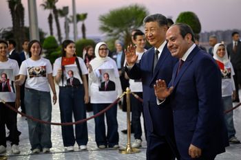 China's President Xi Jinping and his Egyptian counterpart Abdel-Fattah el-Sissi wave upon his arrival at the Cairo International Airport for an official visit to Egypt, in Cairo, Tuesday, Sept. 1, 2026. 