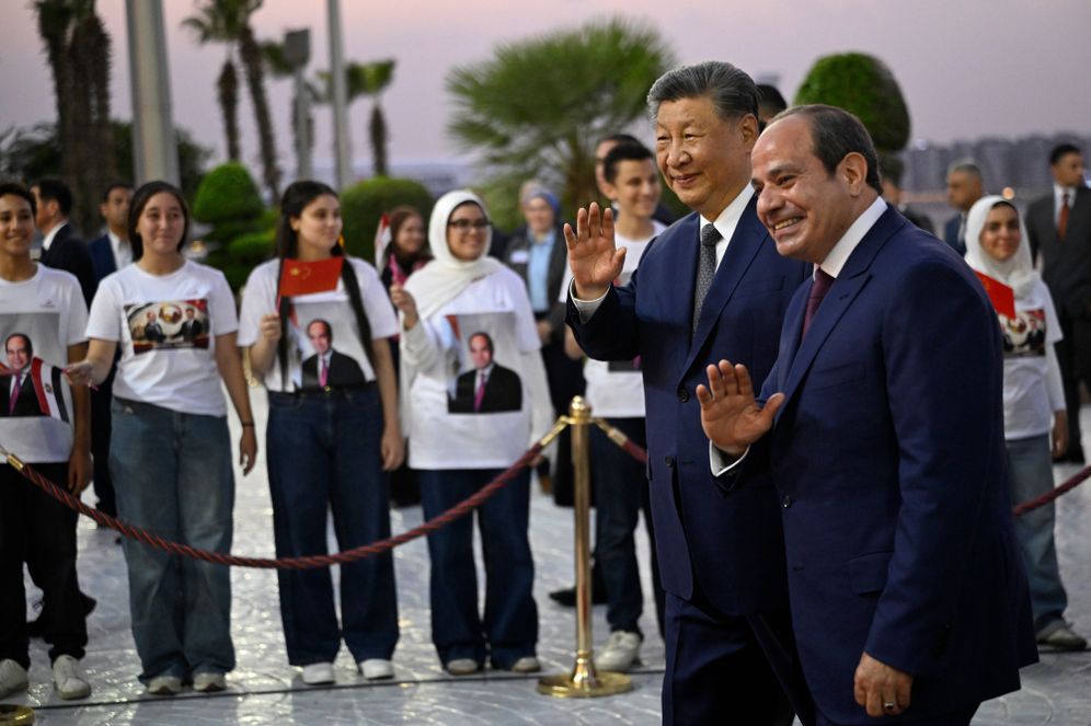 China's President Xi Jinping and his Egyptian counterpart Abdel-Fattah el-Sissi wave upon his arrival at the Cairo International Airport for an official visit to Egypt, in Cairo, Tuesday, Sept. 1, 2026. 