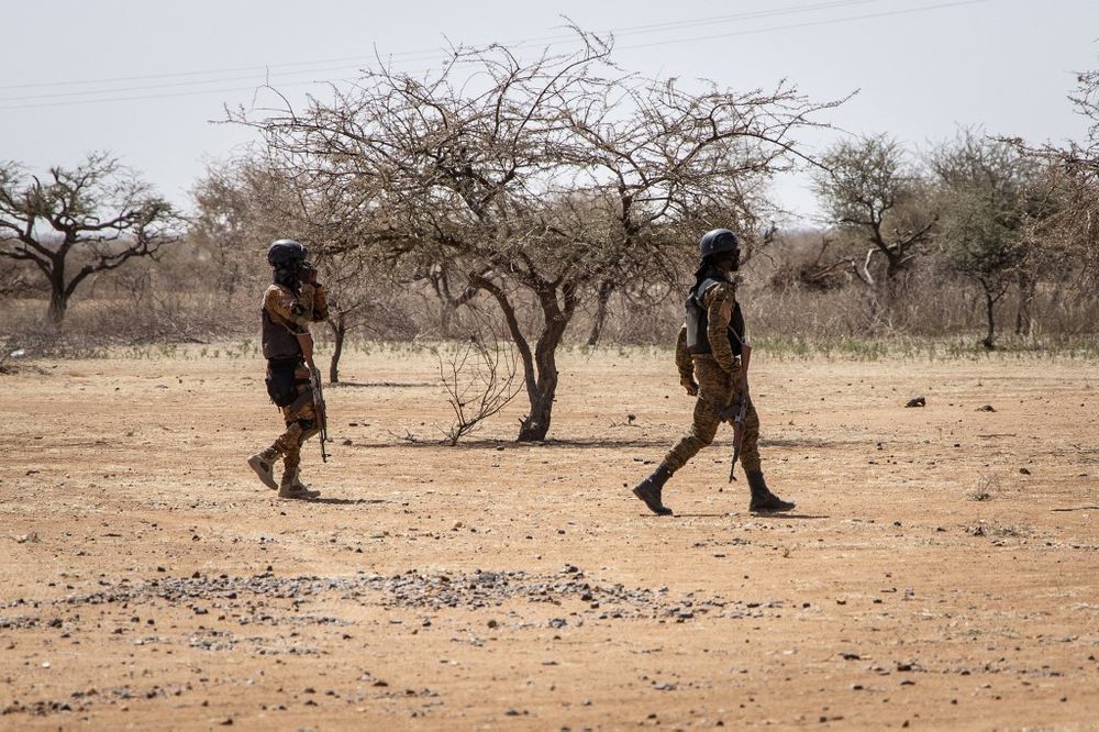 Burkina Faso soldiers patrol at the entrance of the Goudebo refugee camp for Malian refugees, in Dori, Burkina Faso, on February 3, 2020.