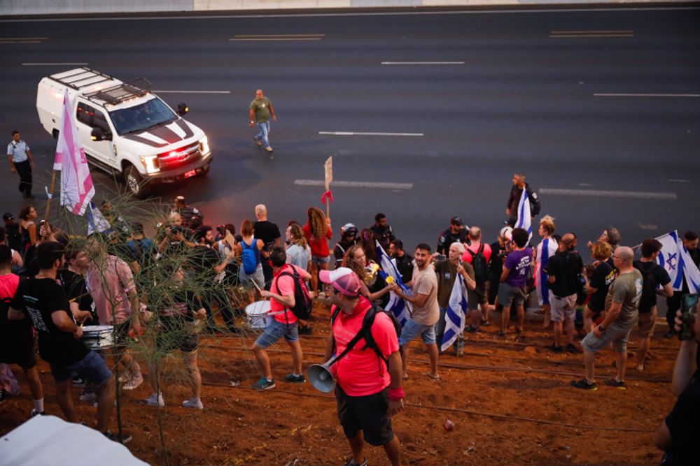 Israeli protesters seen after blocking the Ayalon Highway in Tel Aviv, during a protest against the planned judicial overhaul, on July 1, 2023.