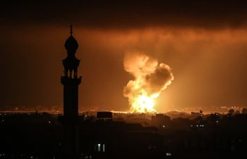Smoke and flames rise after an Israeli airstrike in a site of the Izz al-Din al-Qassam Brigades, the armed wing of Hamas, in the west of Khan Yunis, in the southern Gaza Strip, on May 11, 2021.