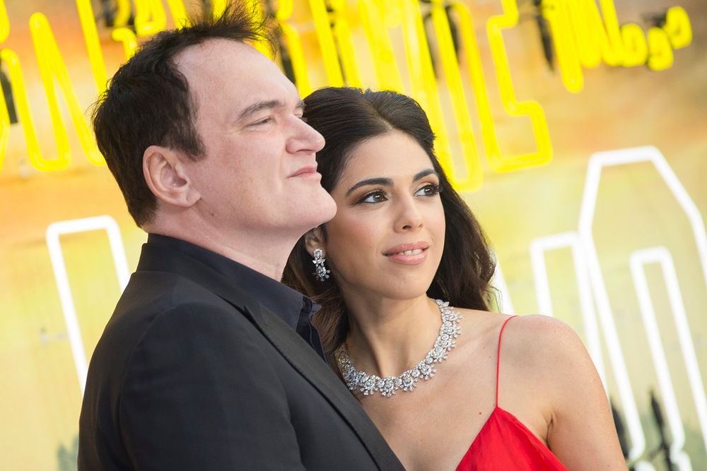 Writer and director Quentin Tarantino (L) and his wife Daniela Pick pose for photographers upon arrival at the premiere of 'Once Upon A Time in Hollywood,' in London, England.