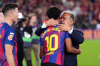 Barcelona president Joan Laporta embraces Barcelona's Lamine Yamal after defeating Real Madrid 2-0 to win the Spanish La Liga soccer championship with three rounds to spare, in Barcelona, Spain, Sunday, May 10, 2026. 