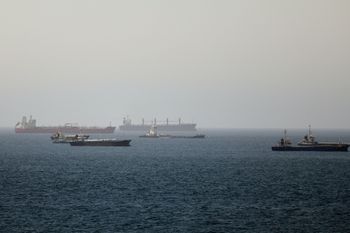 Tankers and cargo vessels are seen in the Gulf of Oman, along shipping routes linking the Strait of Hormuz and the Arabian Sea, Tuesday, June 16, 2026. 
