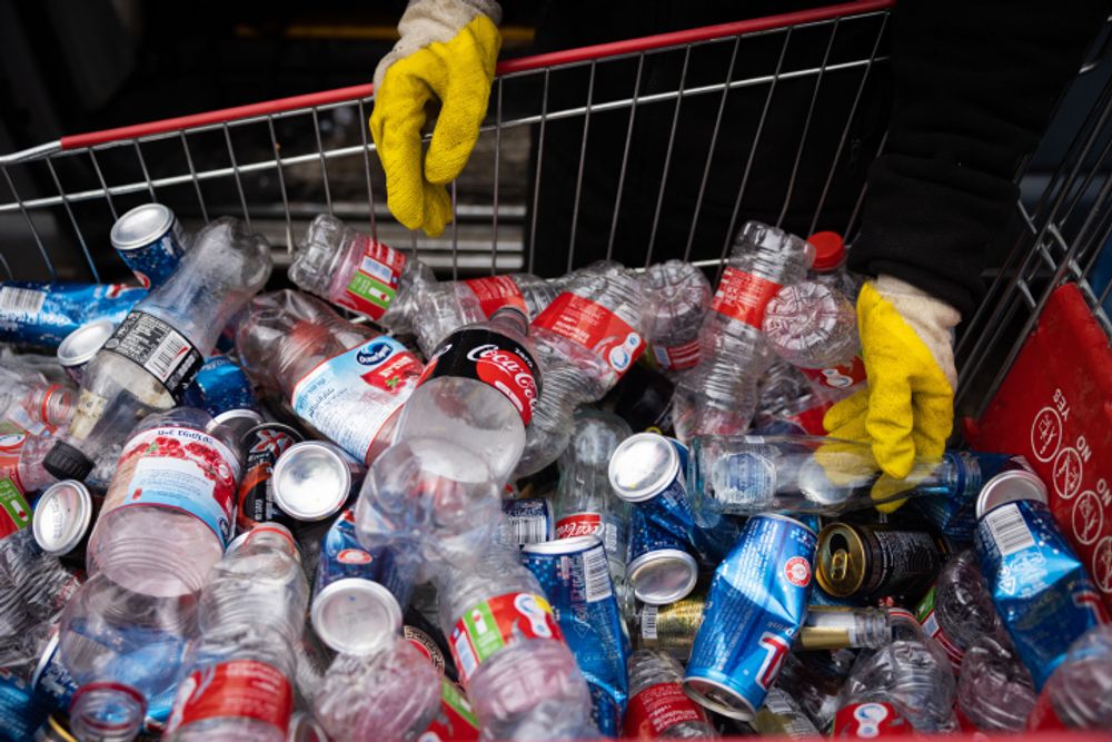 A man sorting bottles for recycling in Givat Shaul, Jerusalem.