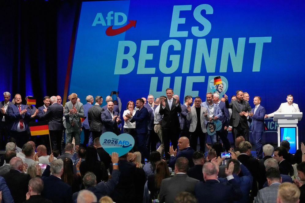 AfD party members celebrate in front of a reading "it starts here" after the first results at an election party of the "Alternative for Germany" (AfD) after the Saxony-Anhalt state elections in Magdeburg, eastern Germany, Sunday, Sept. 6, 2026.