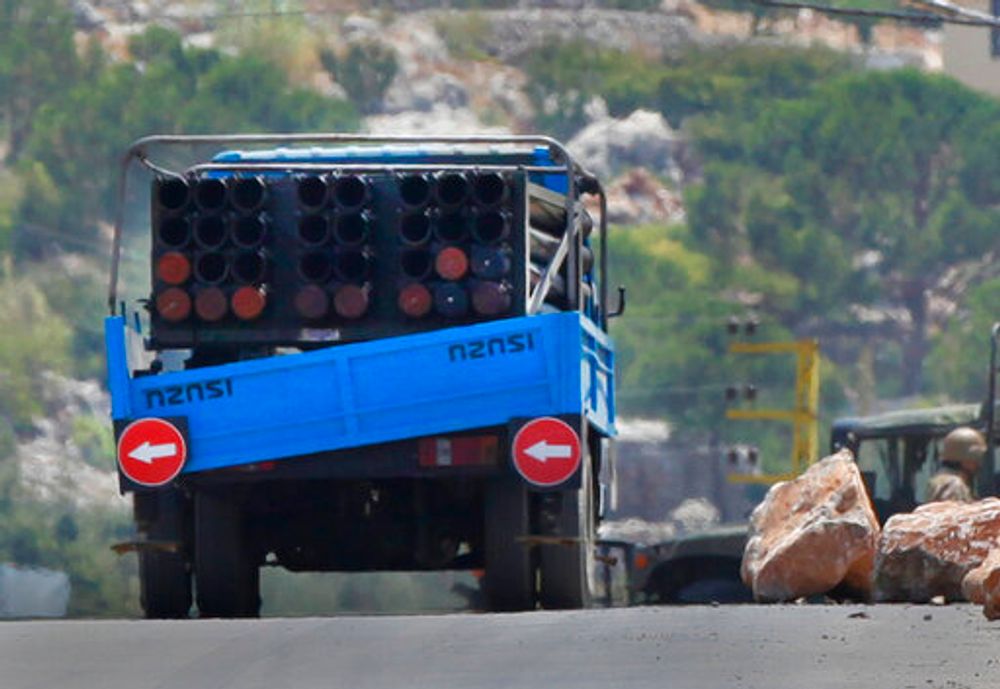 A rocket launcher placed on a pick-up truck that was used by Hezbollah to fire rockets near Israeli positions is seen in the southeastern village of Shwaya, near the border with the Golan Heights, on August 6, 2021.