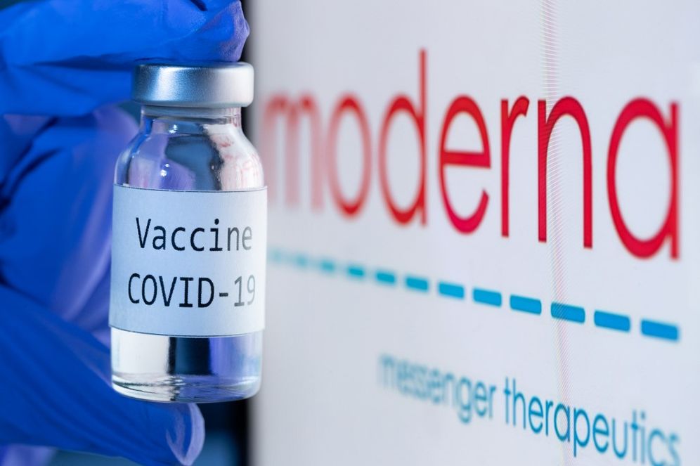 A bottle reading "Vaccine Covid-19" next to the Moderna biotech company logo on November 18, 2020.