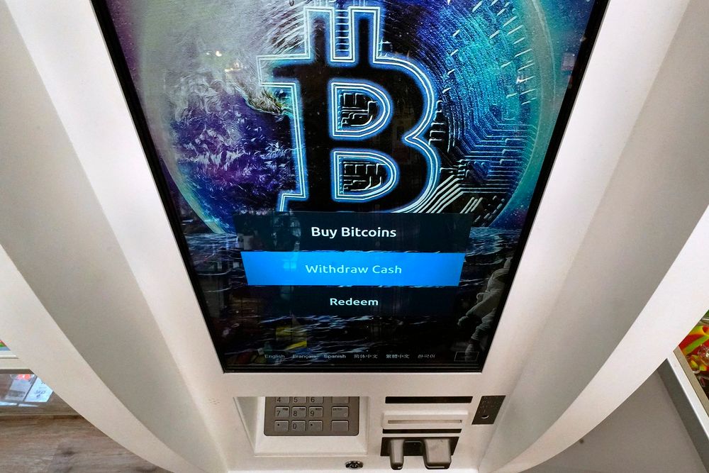 The Bitcoin logo appears on the display screen of a crypto currency ATM at the Smoker's Choice store, on February 9, 2021, in Salem, New Hampshire.