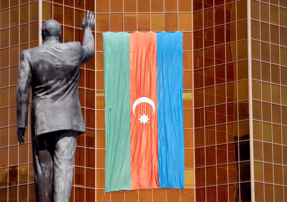 A giant Azeri flag flies on an office building in Baku, Azerbaijan.