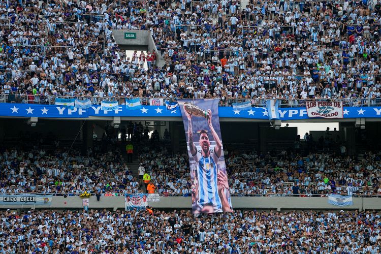 A banner of Lionel Messi holding the FIFA World Cup trophy hangs in the stands prior to an international friendly soccer match between Argentina and Panama in Buenos Aires, Argentina.