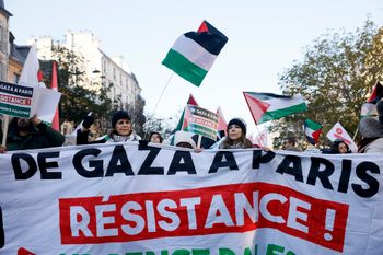 FILE - People chant slogans holding banners that reads "From Gaza to Paris - Residence - Emergency Palestine" during a pro-Palestinian rally, in Paris, Saturday, Dec. 2, 2023.