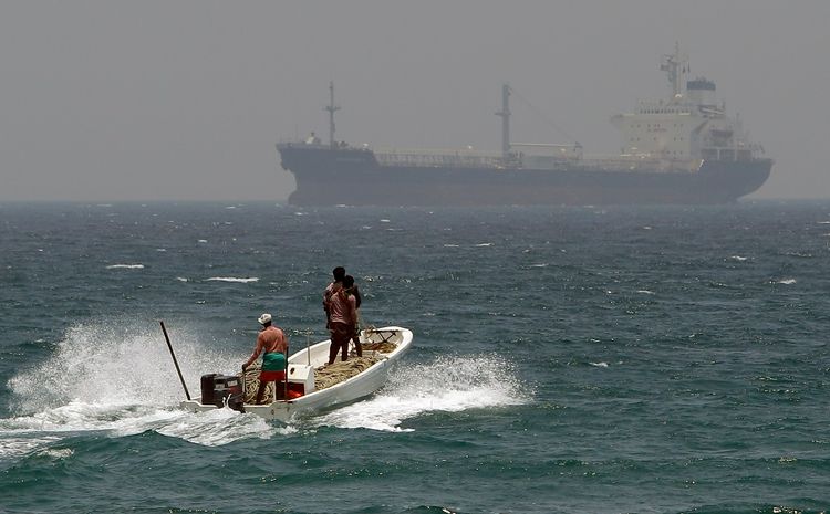 FILE - In this May 30, 2012, file photo, fishermen cross the sea waters off Fujairah, United Arab Emirates, near the Strait of Hormuz.