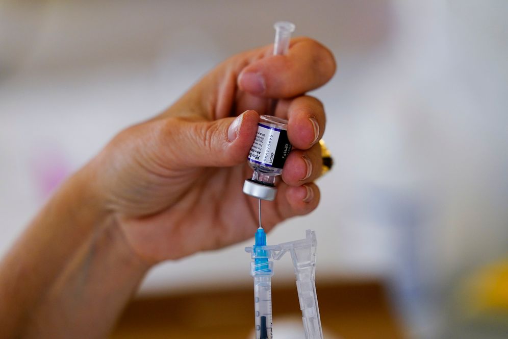 AP Photo/Matt Rourke Syringe is prepared with Pfizer's Covid-19 vaccine at a clinic at the Public Health Center in Norristown, Pa., December 7, 2021.