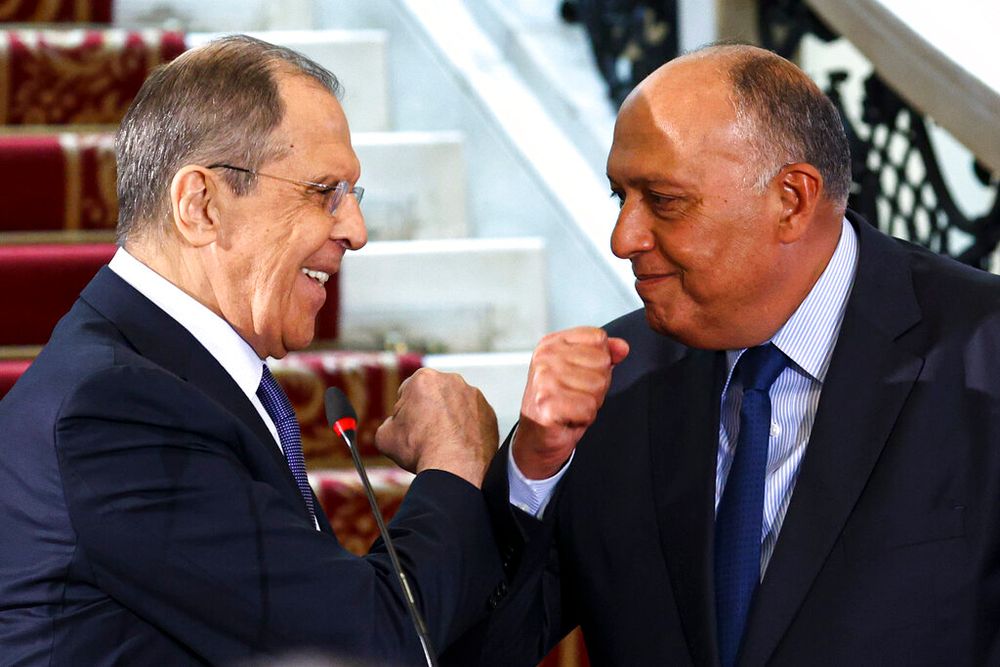 Russia's Foreign Minister Sergei Lavrov and his Egyptian counterpart Sameh Shoukry greet each other in Cairo, Egypt, on April 12, 2021.