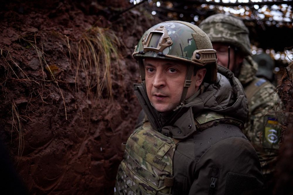 Ukraine's President Volodymyr Zelensky visits combat positions and meets with servicemen at the frontline with Russia-backed separatists in the Donetsk region of Ukraine, on December 6, 2021.