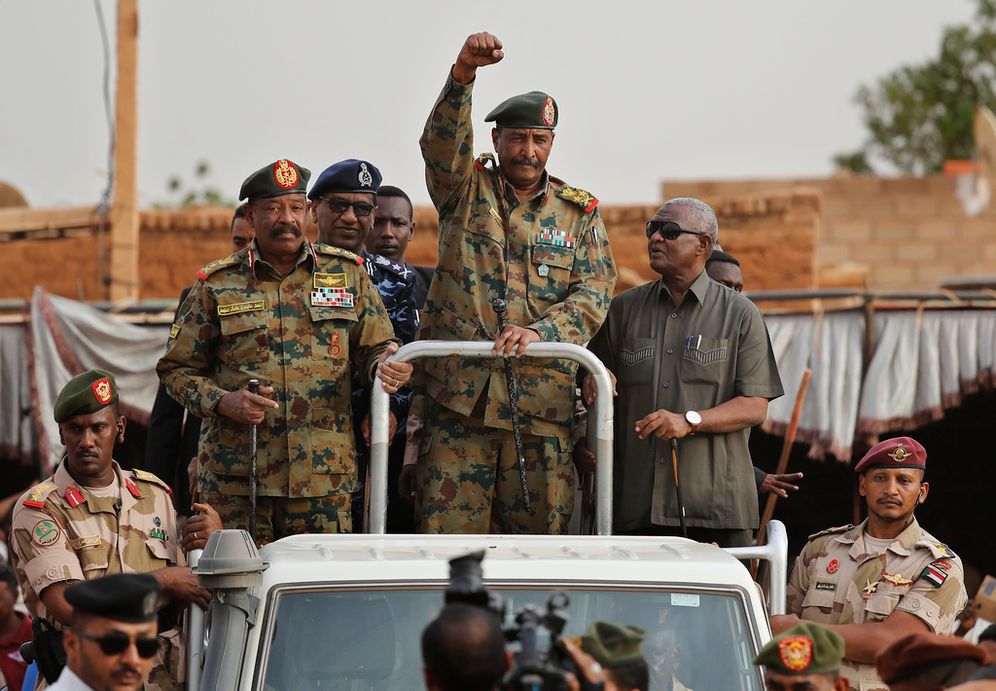 Sudanese army chief General Abdel Fattah al-Burhan (C) waves to supporters in Omdurman district, west of Khartoum, Sudan.