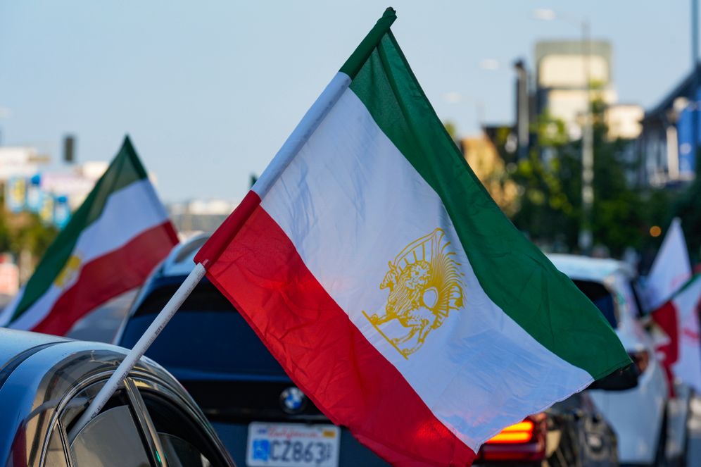AP Photo Vehicles rides while flying the Lion and Sun flag along Westwood Boulevard, in the so-called "Tehrangeles" neighborhood