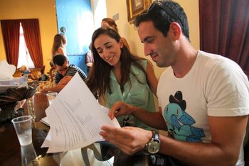 An Israeli couple, Roman (R) and Elinor, read documents before their civil wedding ceremony on October 3, 2013 at Larnaca civil marriage hall in Cyprus.