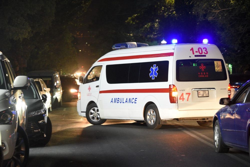 An ambulance moves on a street near a military hospital, where servicemen wounded in night border clashes between Armenia and Azerbaijan receive treatment, in Yerevan, Armenia, on September 13, 2022.