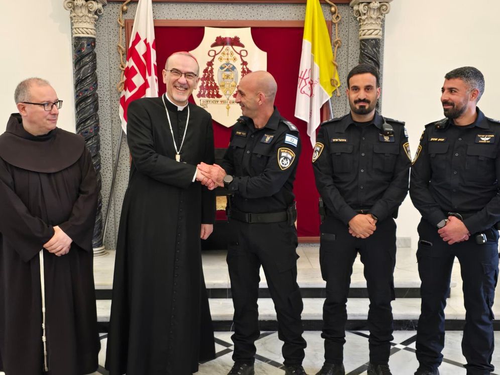 Israeli policemen pose with Cardinal Pierbattista Pizzaballa for a photo