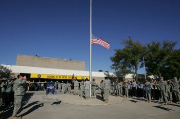 American soldiers stand in memory of the victims of the massacre at Fort Hood base.