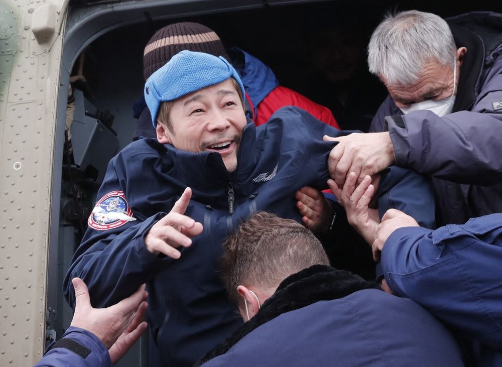 Japanese billionaire Yusaku Maezawa disembarks from a helicopter as he arrives at Zhezkazgan airport after returning from the International Space Station (ISS) in Zhezkazgan, Kazakhstan, December 20, 2021.
