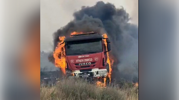 An Israeli firetruck on fire as teams try to put out a massive brush fire that erupted near Beit Shemesh