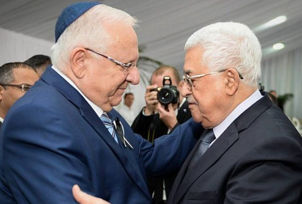 Israeli President Reuven Rivlin meets with Palestinian Authority President Mahmoud Abbas at Mount Herzl Cemetery in Jerusalem on September 30, 2016.