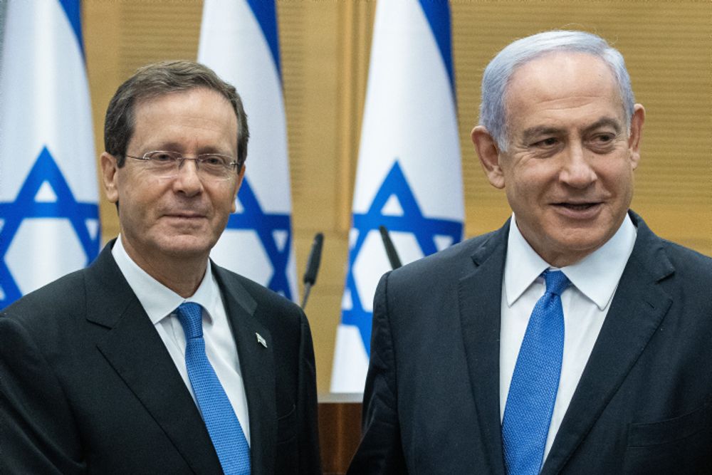 Israel's newly elected president Isaac Herzog with Israel's then-Prime Minister Benjamin Netanyahu in the Knesset (Israel Parliament) on the day of the presidential elections, in Jerusalem on June 2, 2021.