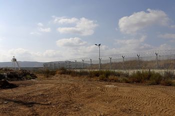 A general view shows a UN watchtower near a border fence that surrounds the village of Ghajar, which sits on the border of Lebanon, Israel and Syria, on September 7, 2022