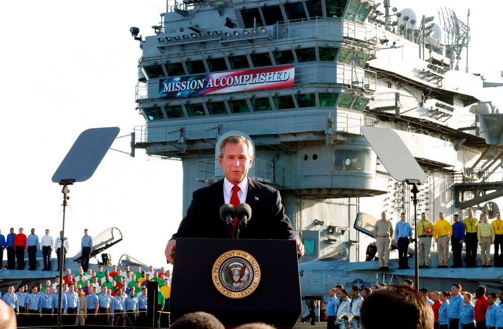 AP Photo/J. Scott Applewhite Then-U.S. President George W. Bush declares the end of major combat in Iraq as he speaks aboard the aircraft carrier USS Abraham Lincoln off the California coast, United States.