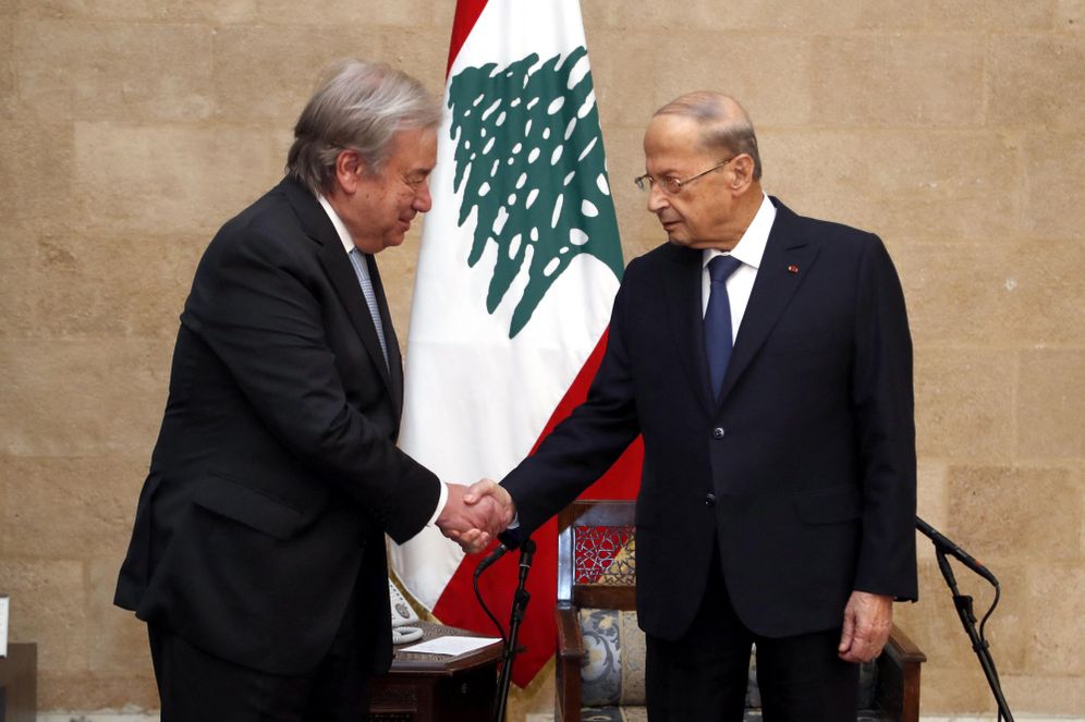 Lebanon's President Michel Aoun (R) greeting UN Secretary-General Antonio Guterres during a visit to the presidential palace in Baabda, east of the capital Beirut on December 19, 2021.