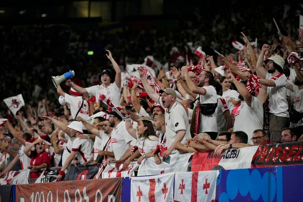 Georgia's fans celebrates during a Group F match between Georgia and Portugal at the Euro 2024 soccer tournament in Gelsenkirchen, Germany, Wednesday, June 26, 2024.