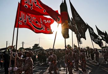 Members of Iran's Islamic Revolutionary Guard Corps (IRGC) marching during the annual "Sacred Defence Week" military parade marking the anniversary of the outbreak of the 1980-1988 war with Saddam Hussein's Iraq, in the capital Tehran. September 22, 2019.