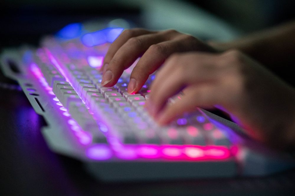 A member of the hacking group Red Hacker Alliance using his computer at their office in Dongguan, China.