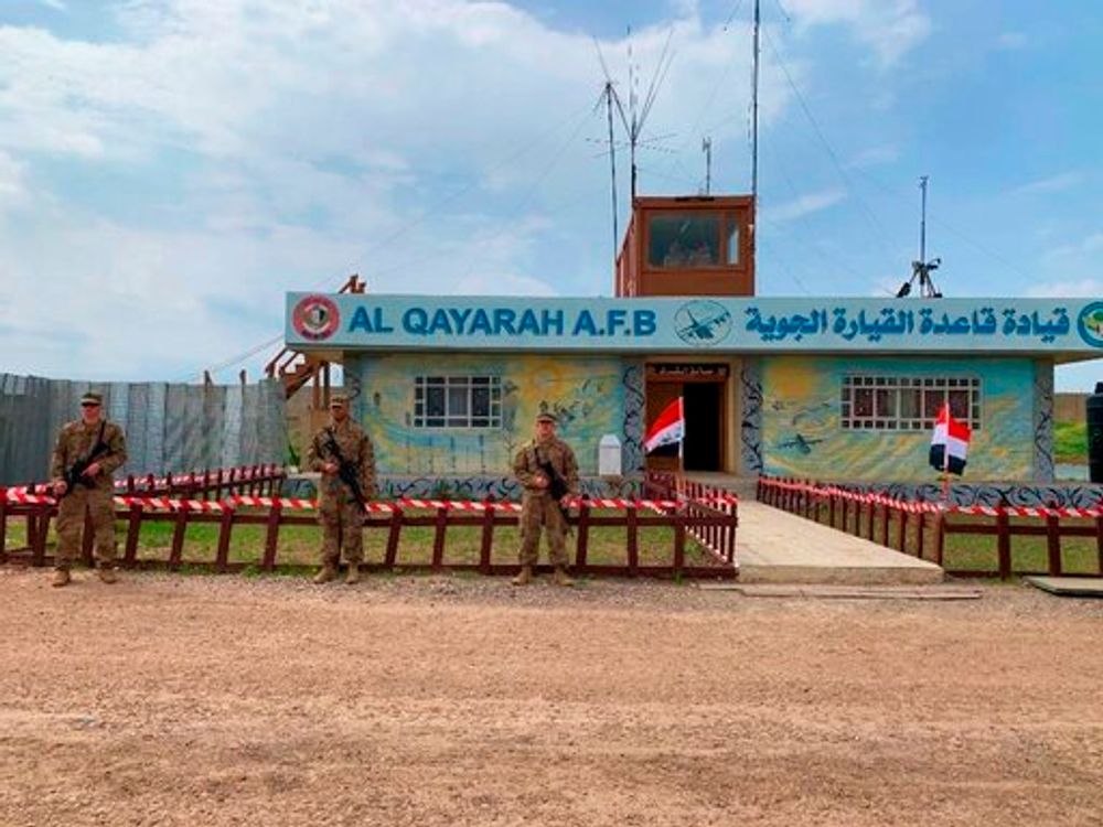 US soldiers stand guard in the south of Mosul, Iraq, March 27, 2020.
