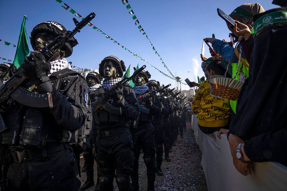 Members of the Izz ad-Din al Qassam Brigades, the armed wing of the Palestinian terror group Hamas, parade in Gaza City, Gaza.