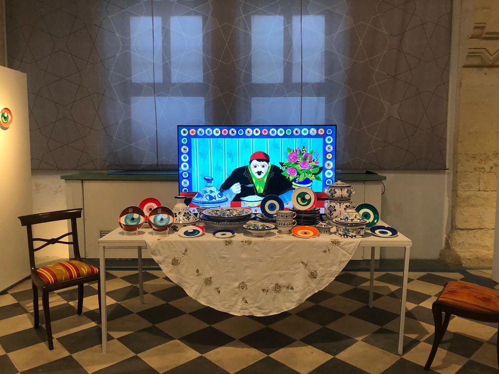 An assembly of dishes and art at the "Affaire de famille" exhibtion in Beer Sheba, Israel.