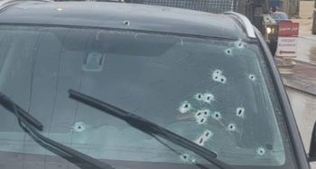 The vehicle attacked in Huwara showing multiple bullet holes to the windscreen on the driver's side.
