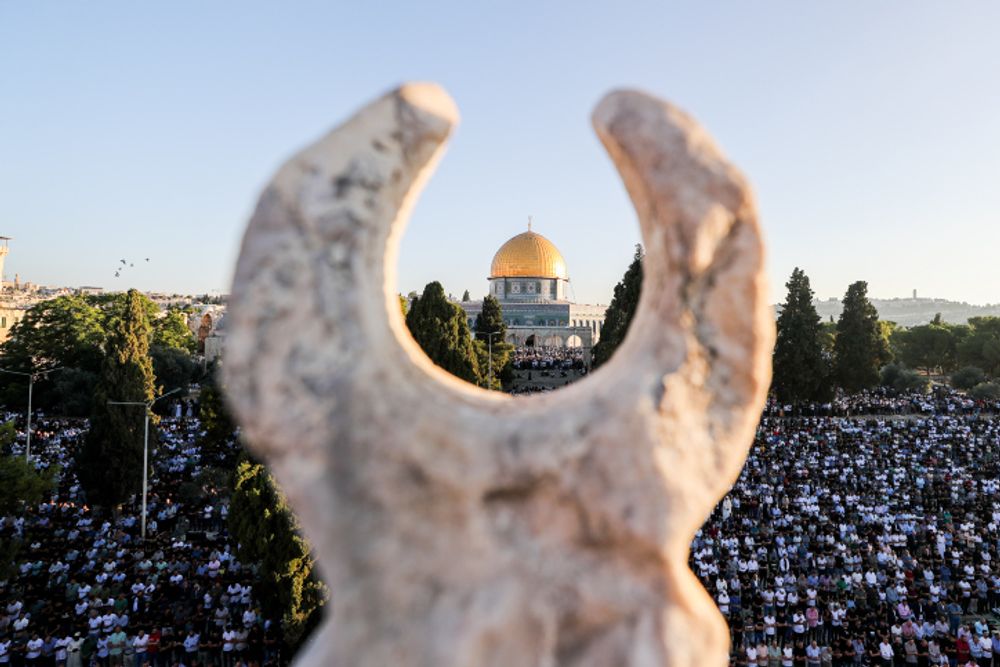 Thousands of Palestinians attend Eid prayers at the Al Aqsa Mosque, in Jerusalem's Old City, marking the muslim holiday of Eid al-Adha