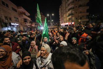 Freed Palestinian prisoners arrive at to Beitunia, near the West Bank city of Ramallah.