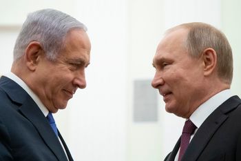 Russian President Vladimir Putin, right, and Israeli Prime Minister Benjamin Netanyahu greet each other during their meeting in the Kremlin in Moscow, Russia, Thursday, April 4, 2019.