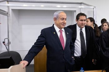 Israeli Prime Minister Benjamin Netanyahu arrives to the courtroom at the Distrcit court in Tel Aviv, before the start of his testimony in the trial against him