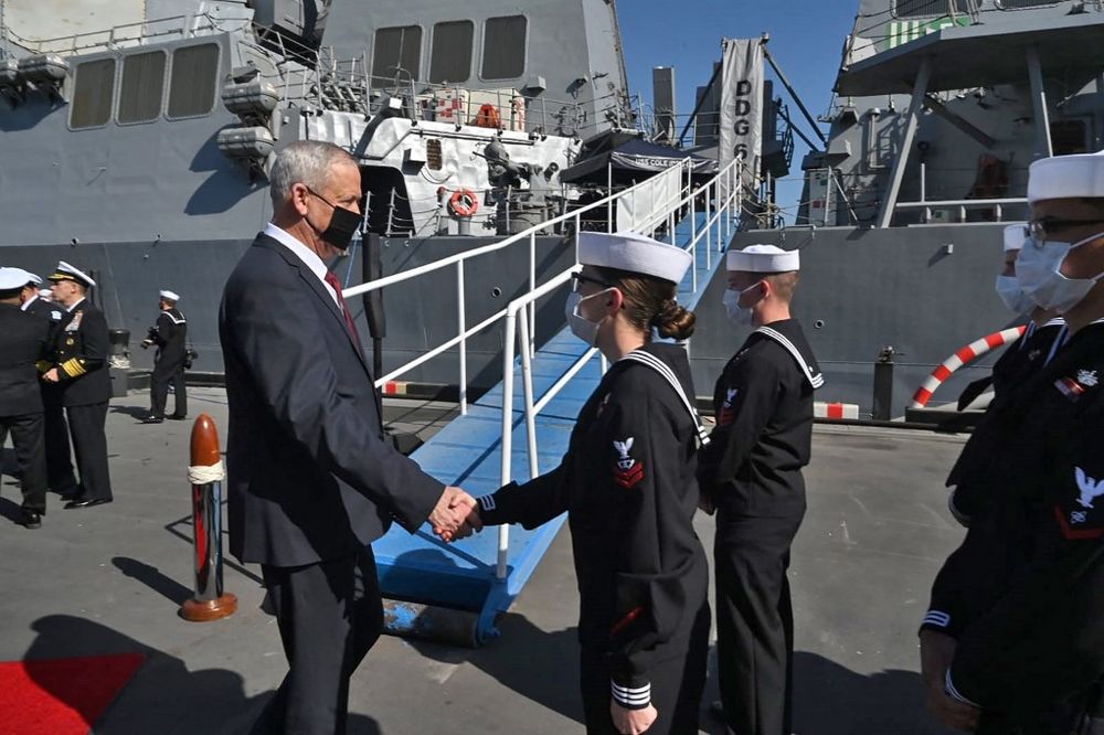 A handout picture obtained from Israel's Government Press Office on February 3, 2022, shows Defense Minister Benny Gantz with US navy personnel at the US Fifth Fleet headquarters in Manama, Bahrain.