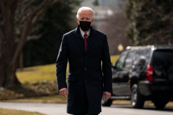 US President Joe Biden walks over to speak with reporters before boarding Marine One to visit wounded troops at Walter Reed National Military Medical Center, at the White House, on January 29, 2021, in Washington.