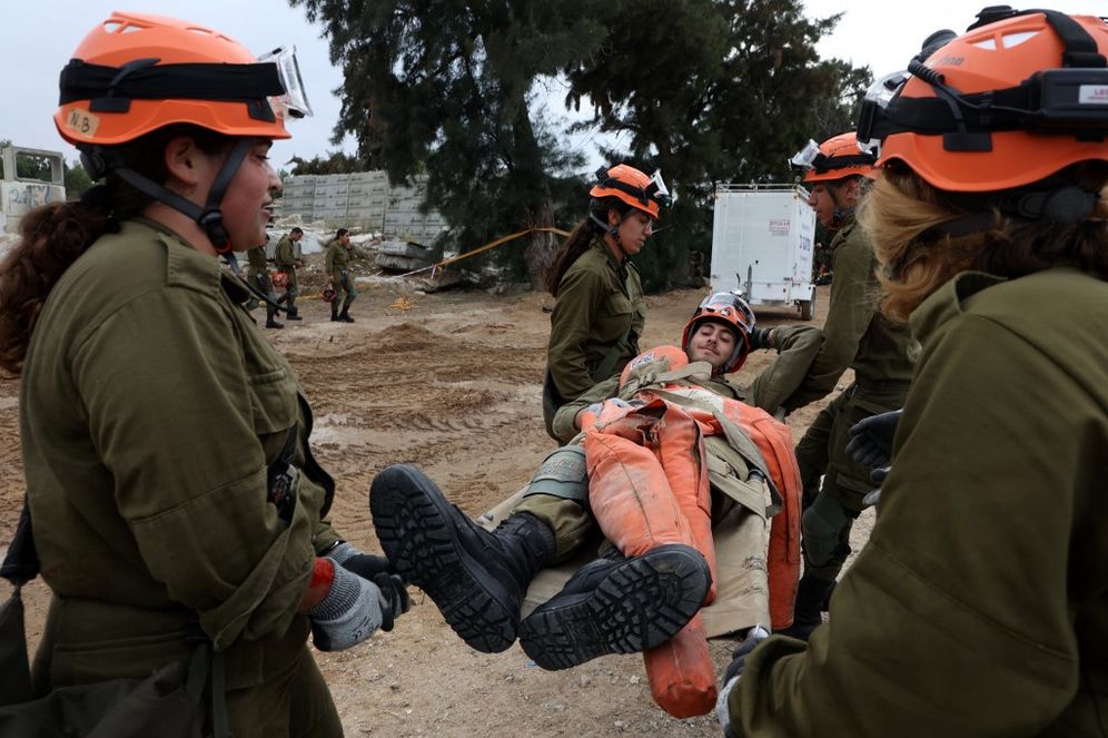Israeli soldiers take part in a rescue drill simulating an emergency situation such as the aftermath of an earthquake in southern Israel.