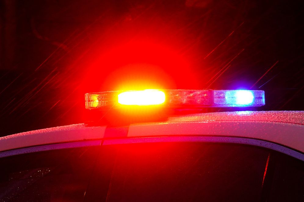 AP FILE - Lights flash on top of a police car