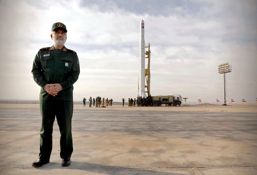 Islamic Revolution Guards Corps (IRGC) Aerospace Force Brig.-Gen. Amir Ali Hajizadeh stands in front of an Iranian rocket carrying a satellite in an undisclosed site believed to be in Iran's Semnan province on April 22, 2020.