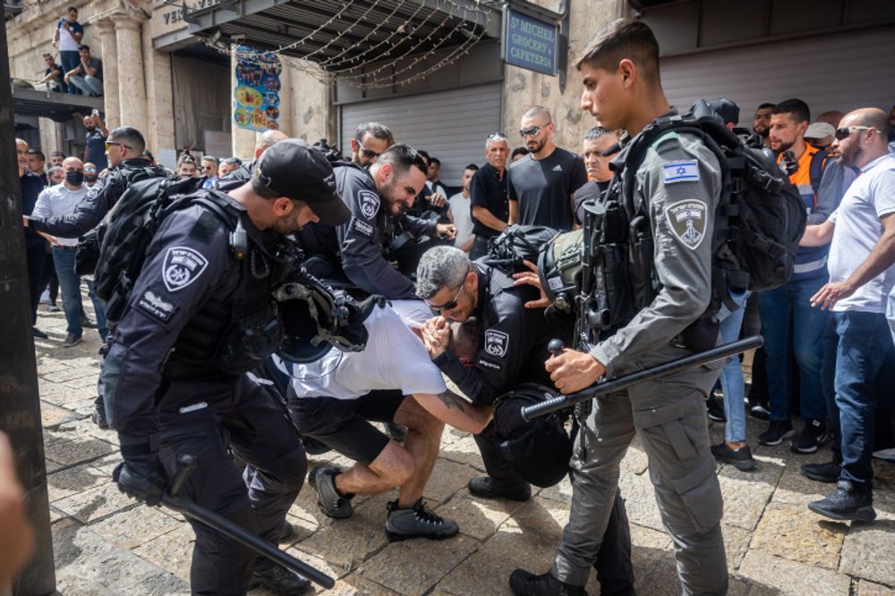 Israeli border police arrest a man in Jerusalem's Old City, ahead of the funeral of Al Jazeera journalist Shireen Abu Aqleh, May 13, 2022.